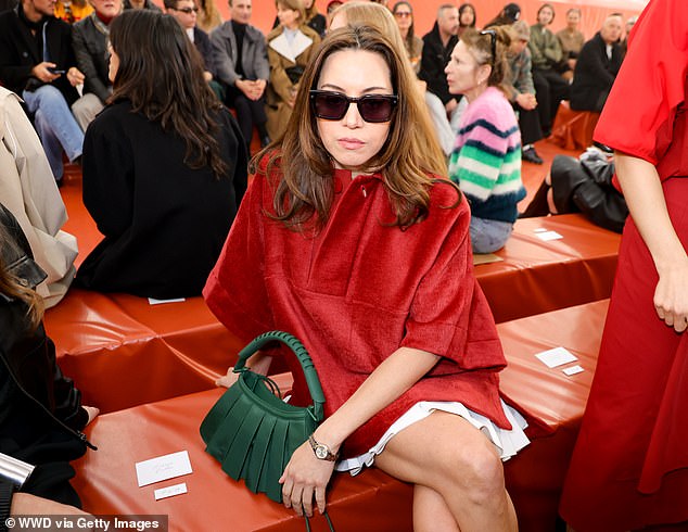 Aubrey put on a leggy display for the glitzy event as she wore a white, pleated skirt. She layered a red velvet cape over her mini skirt and slipped into a pair of quirky orange heels