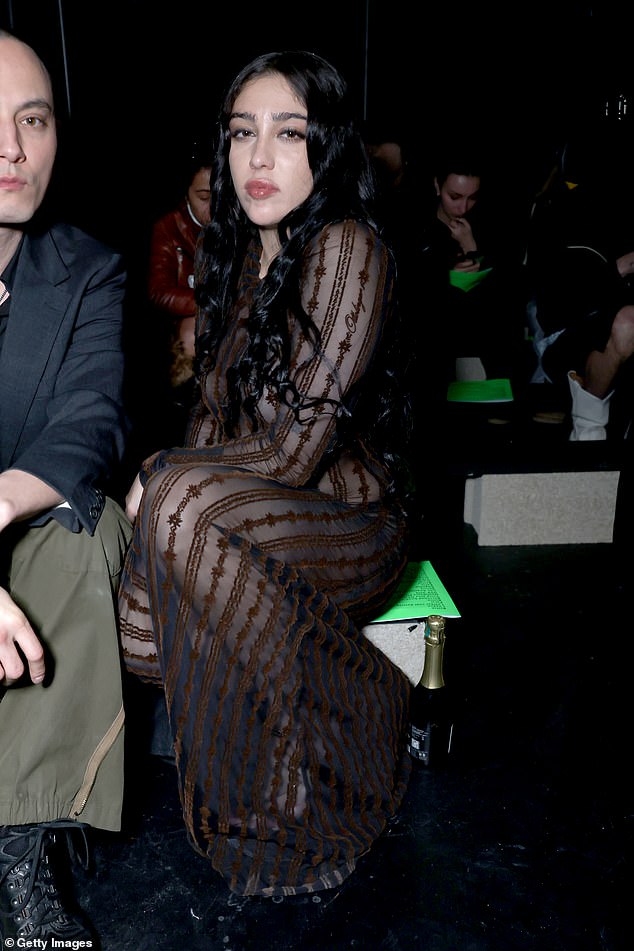 The stunner styled her dark tresses in waves and elevated her frame in a pair of towering heels