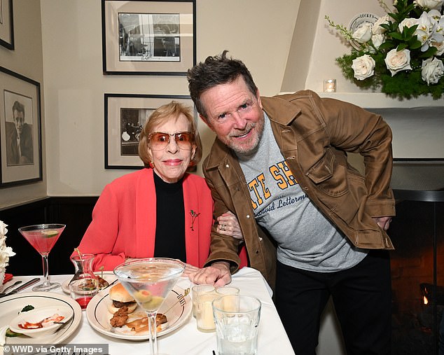 Fox — who went public with his Parkinson's disease diagnosis in 1998 — stopped by Carol Burnett's table while the 92-year-old actress was enjoying a cocktail