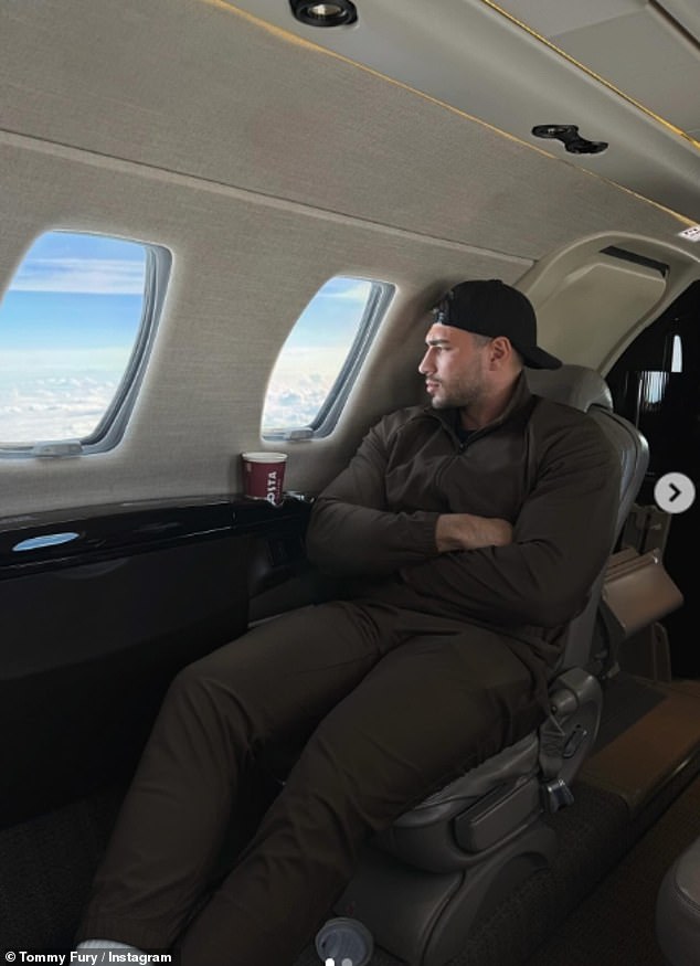 In another, the boxer cuddled Bambi on their luxurious private jet and shared this photo looking out at the view while enjoying a coffee