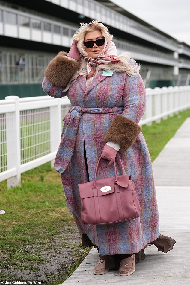Gemma oozed glamour in her chic ensemble and held onto her headscarf as she battled 50mph winds