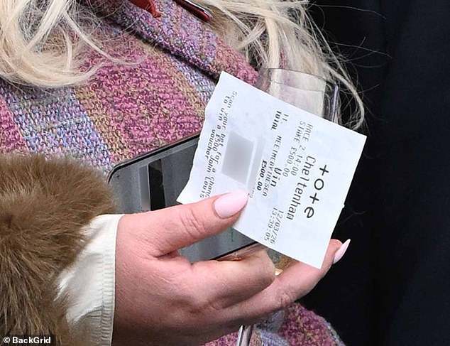 She was proudly holding her slip in hand as she prepared to collect her winnings