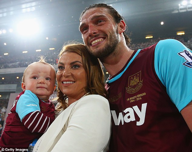 Footballer Andy Carroll poses with then fiancee Billi Mucklow and their son Arlo in 2016