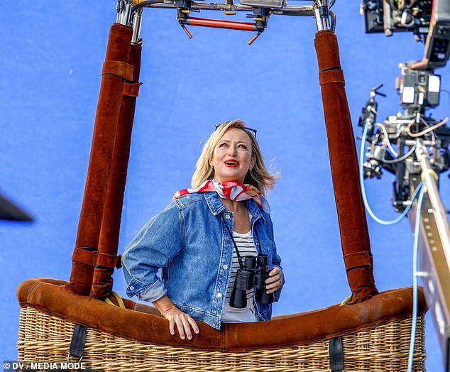 The pair looked very much in their element, smiling and waving to the crew on the ground