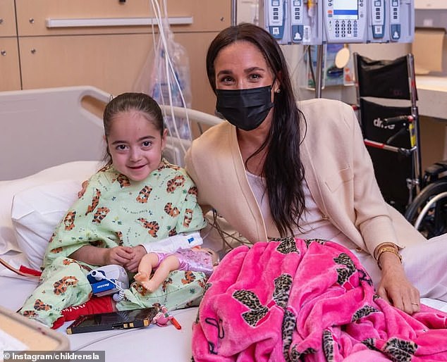 The annual fundraiser is set up by the organisation to support lifesaving care and research that happens daily at the hospital. (Pictured the Duchess of Sussex with a young patient)