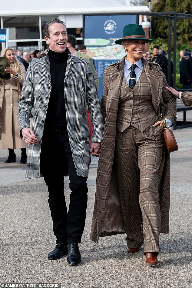 Hannah Waddingham, 51, held hands with spine surgeon Nick Beresford-Cleary as they arrived at Cheltenham Festival on Friday