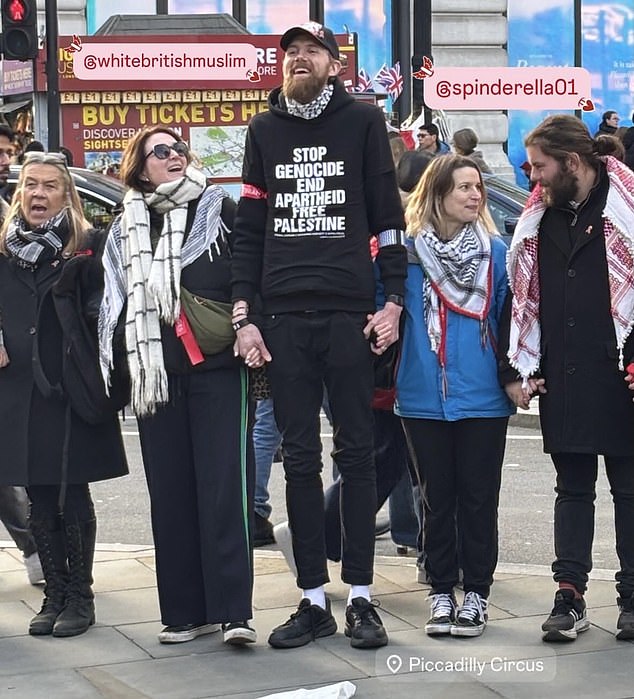 Thomas Abdullah Bourne (centre), 39, an Islamic convert who uses the social media handle 'White British Muslim', followed the Jewish comedian, 51, as he rode the elevator on the Tube