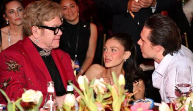 Elton John looked to be playing mediator between his godson Brooklyn Beckham and the hot-sauce influencer's superstar family at an Oscars viewing party on Sunday