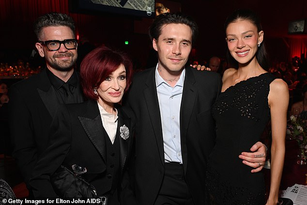 Nicola and Brookyn posed with members of another famous family in the form of Sharon and Jack Osbourne