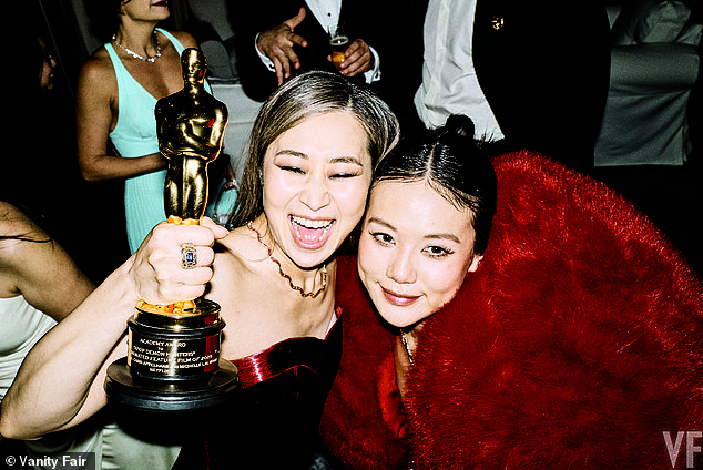 Kpop Demon Hunters artist and writer Maggie Kang holds her Oscar for Animated Feature Film