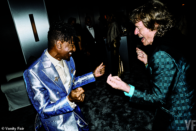 John Batiste, who delivered a surprise performance at the bash, lets loose with Sir Mick Jagger