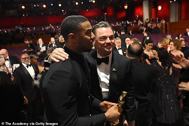 Leonardo DiCaprio with his arm around Jordan after the Sinner's star won his Oscar