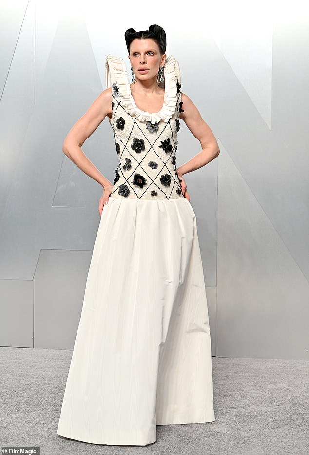 Julia Fox - best known for being the ex-girlfriend of Kanye West - also took to the Vanity Fair pewter carpet in a bizarre outfit