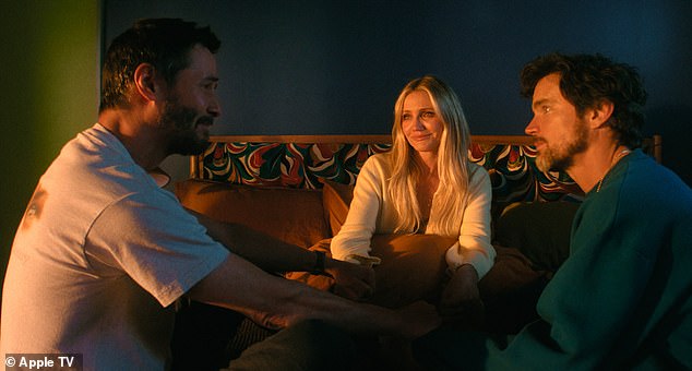 Here she is seen with Keanu Reeves, left, and Matt Bomer, right