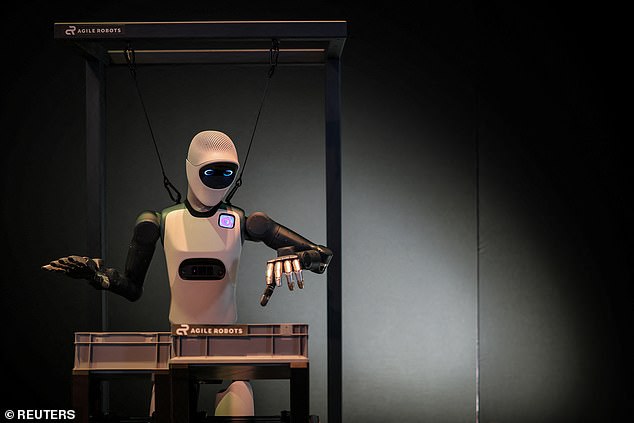 The rise of robots is wiping out entry-level jobs, the Bank of England has warned. Pictured: A robot demonstrates a task at the NVIDIA booth during the NVIDIA GTC global AI conference in San Jose, California, U.S., March 17, 2026