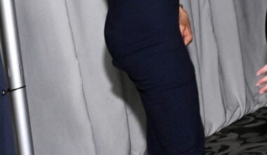 The Duchess of Sussex leaves the red carpet and waves to the photographers at a Beverly Hills charity bash last night