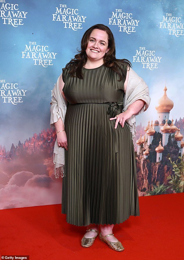 Jessica Gunning, who stars as Dame Washalot, looked effortlessly elegant in a forest green pleated dress, a grey shawl and gold flats