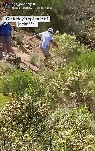 His caddie rushed to save him as he slipped down a hill