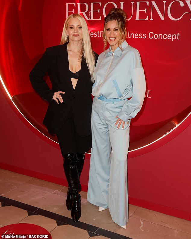 Ashley, 44, looked chic in a blue zip-up polo top and matching wide-leg trousers as she joined bandmate Kimberly at the event