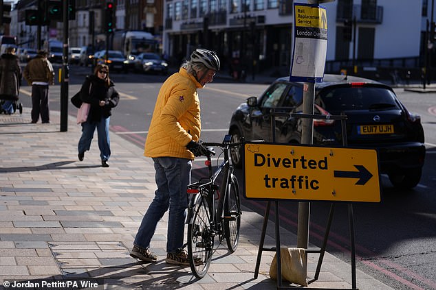 James May arrives by bicycle at Lavender Hill Magistrates' Court in South London today