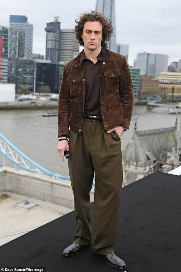 The actor cut a suave figure in a brown suede jacket