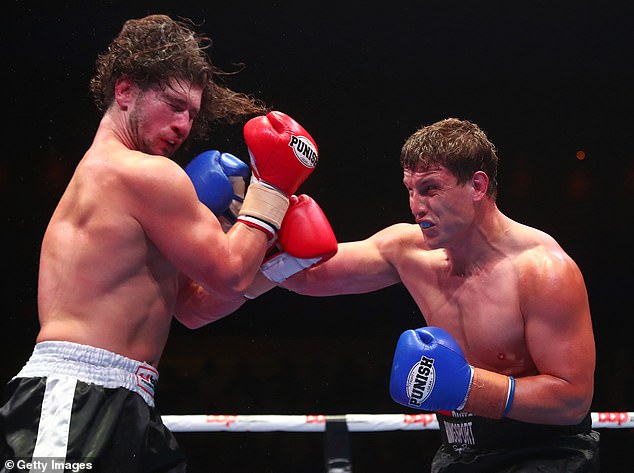 NRL star turned heavyweight boxer Jarrod Wallace has his wife to thank after an honest 'spray' from his wife Shannon got his life back on track (pictured right, fighting Nick Timms)