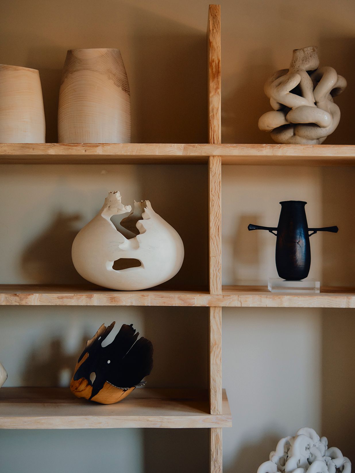 Image may contain Shelf Clothing Glove Wood Furniture and Bookcase