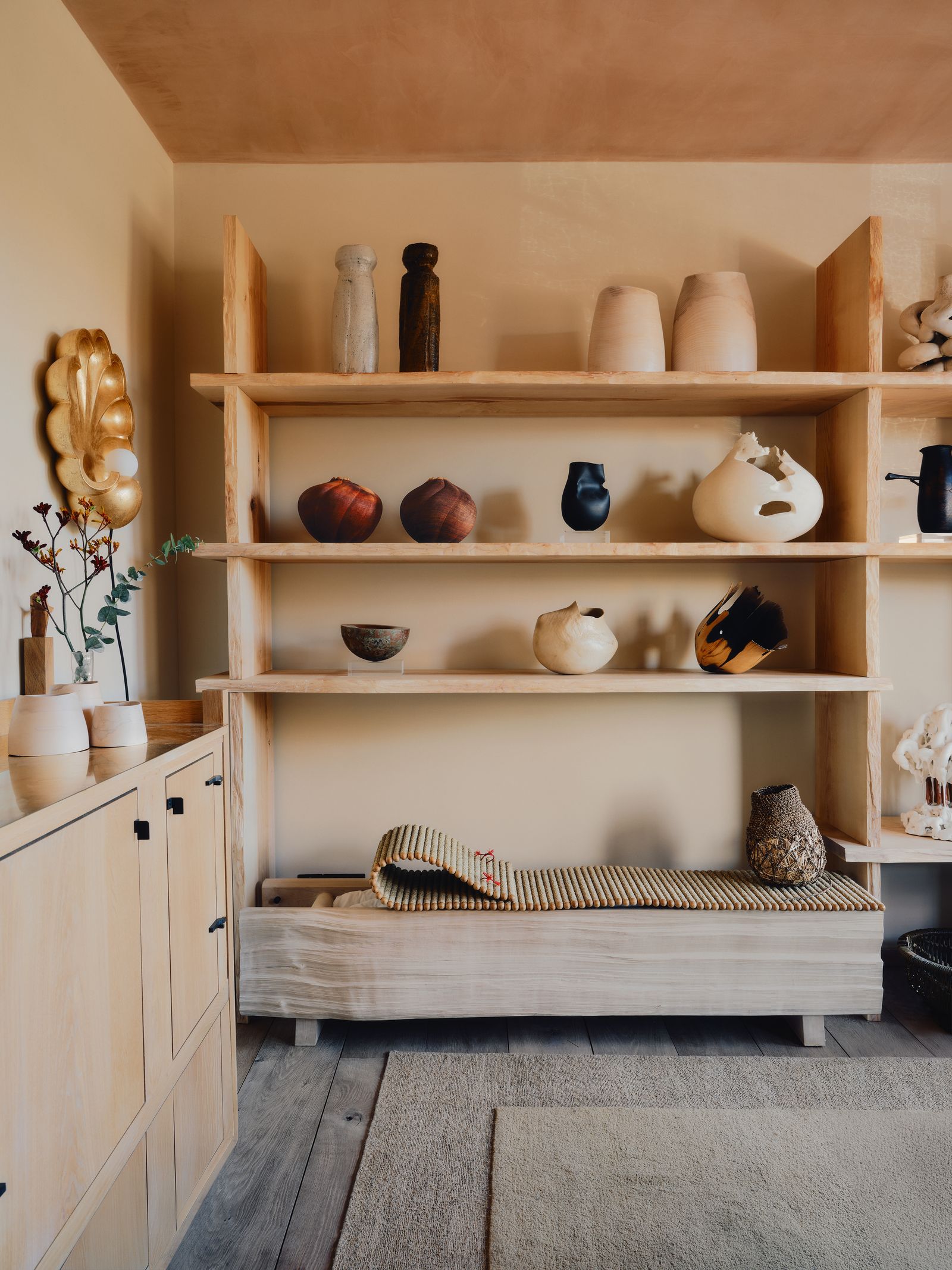 Image may contain Indoors Interior Design Furniture Bookcase Home Decor and Wood