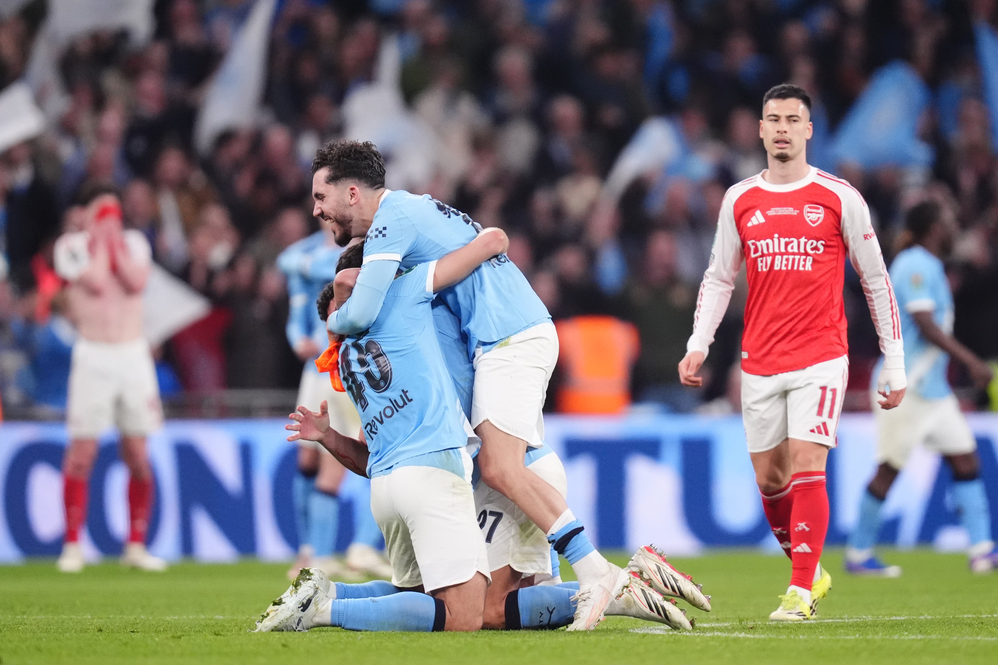 Manchester City celebrate victory at Wembley (John Walton/PA).