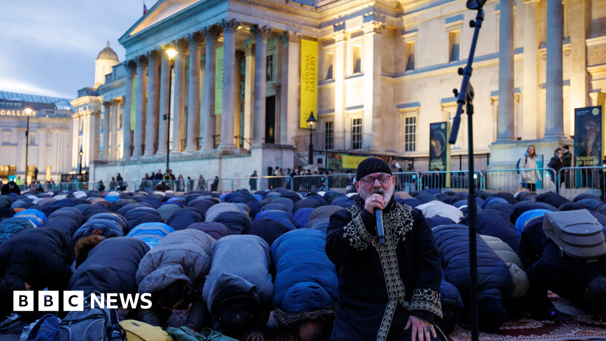 Members of the Muslim community pray ahead of the 'open iftar' Ramadan dinner event at Trafalgar Square in London