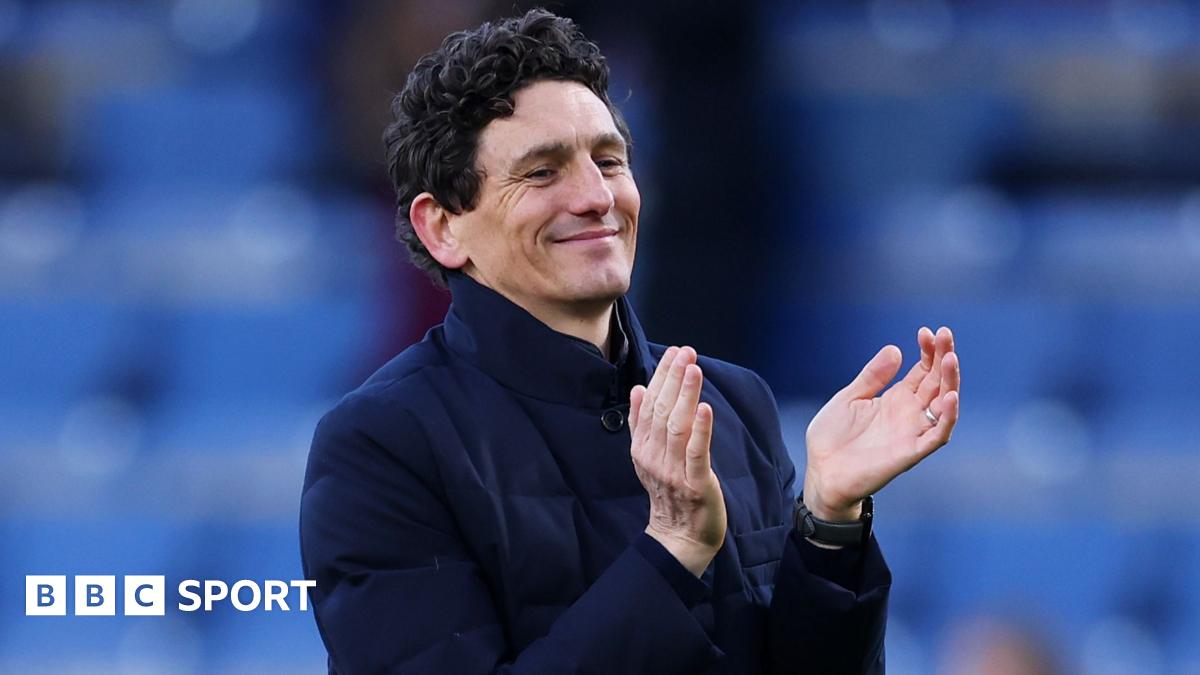 Brentford manager Keith Andrews applauds fans