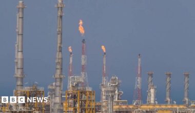 Fire blows out of a tall chimney at a facilities on the South Pars gas field.