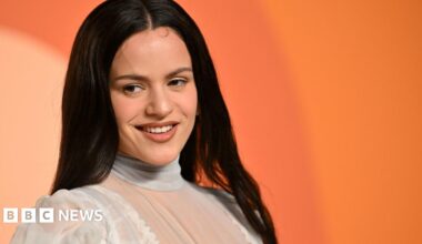 Spanish singer Rosalia tosses her hair as she turns to look at the audience during a concert on her 2022 Motomami tour in Seville, Spain