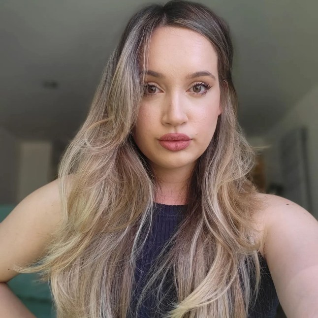 Laura stares sadly at the camera