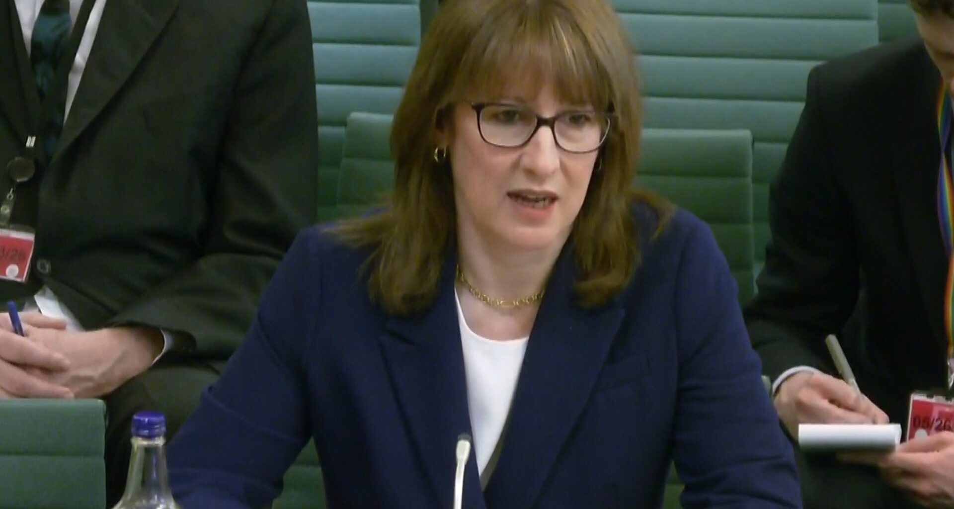 Rachel Reeves speaking at Treasury Committee meeting, highlighting key points on financial policies, dressed in business a...