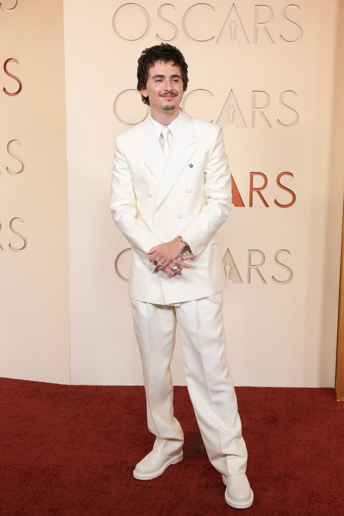 Timothee Chalamet wears all white on the red carpet at the 98th Annual Academy Awards 