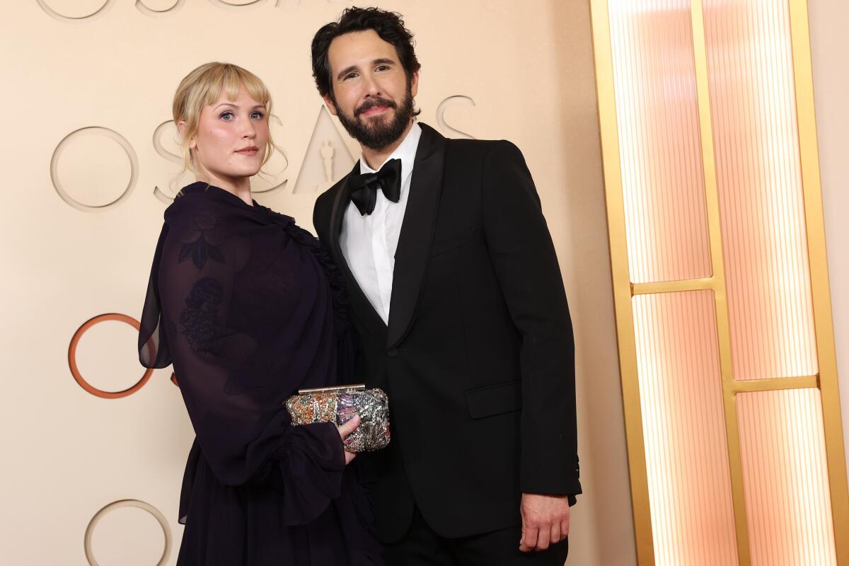 Natalie McQueen, left and Josh Groban arrive on the Oscars red carpet