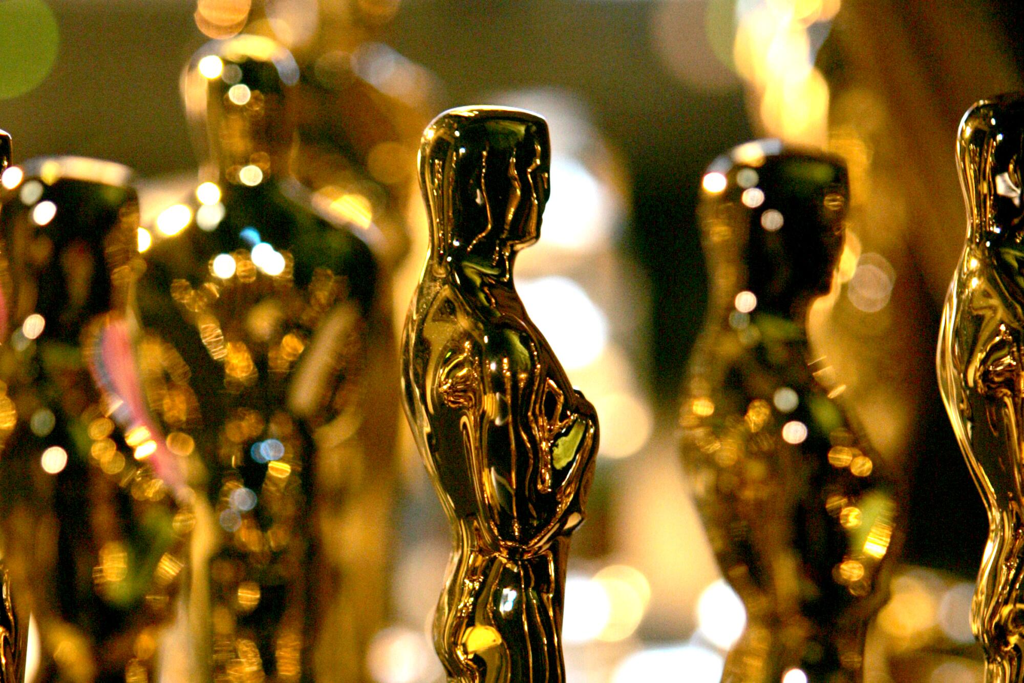 Multiple Oscars glimmer in the light. 