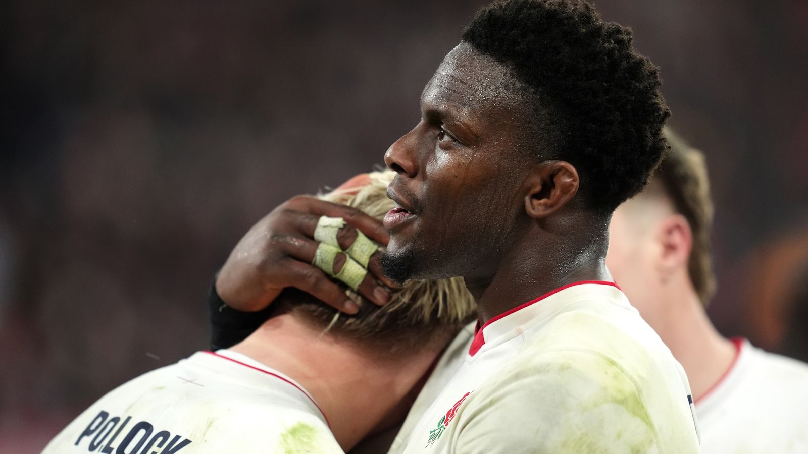 England captain Maro Itoje consoles Henry Pollock after the loss to France