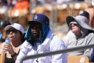 Baseball fans watch the Los Angeles Dodgers play the San Francisco Giants during the fifth inning of a spring training baseball game with the heat forcing the game to end early, Wednesday, March 18, 2026, in Phoenix. (AP Photo/Ross D. Franklin)