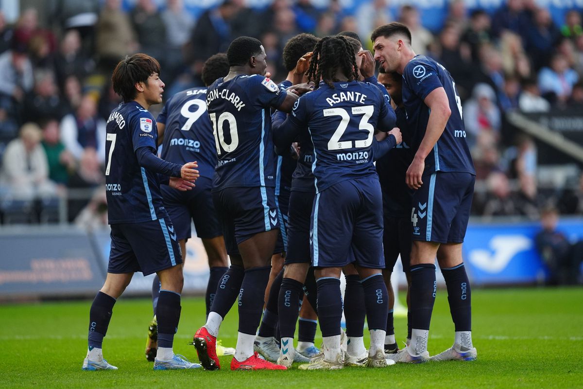 Coventry City's Matt Grimes (centre)celebrates with teammates after scoring