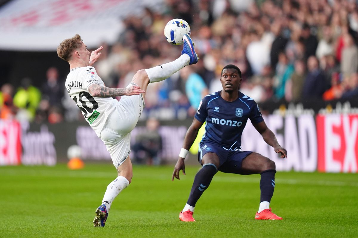 Swansea City's Ethan Galbraith (left) and Coventry City's Ephron Mason-Clark