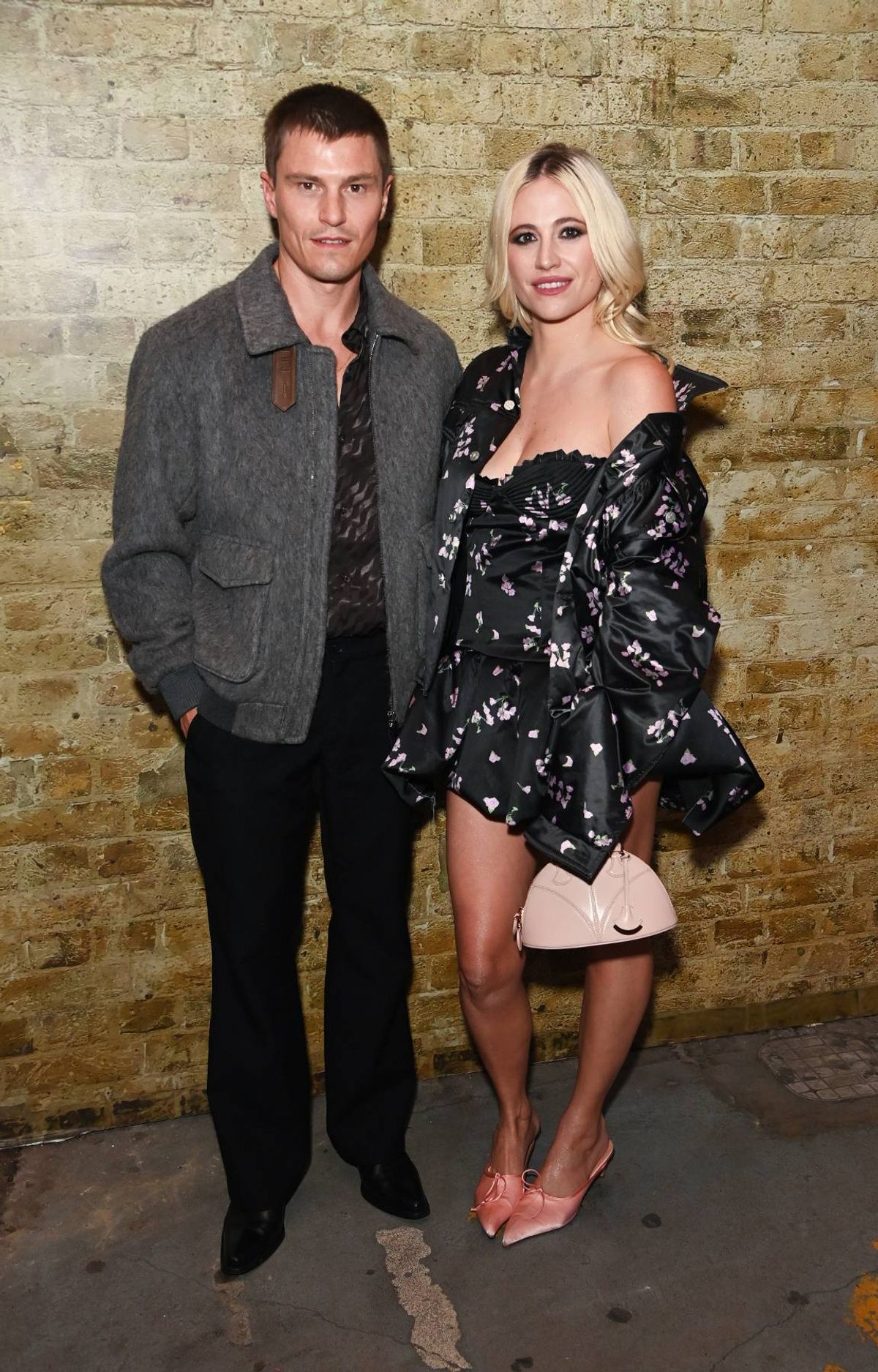 pixie lott and hubby oliver cheshire posing at london fashion week show 2026