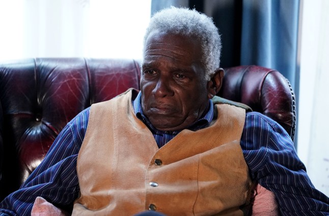 Patrick Trueman looking devastated as he sits in an armchair in EastEnders.