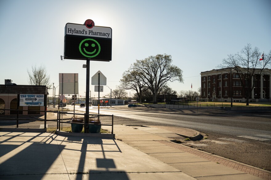 The sign in front of Hyland’s Pharmacy in Wheeler.