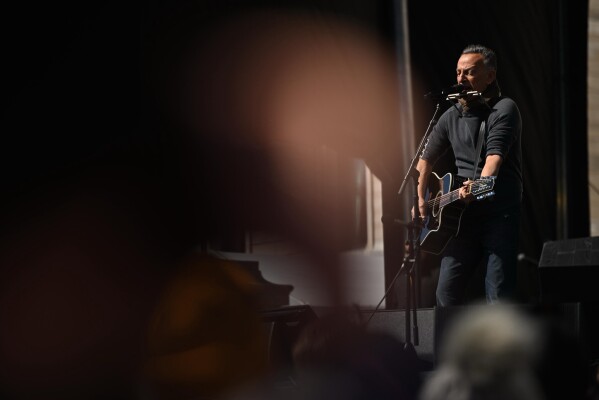 Bruce Springsteen performs during the "No Kings" protest Saturday, March 28, 2026, in St. Paul, Minn. (AP Photo/Tom Baker)