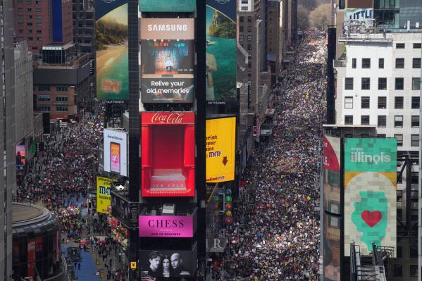 People attend a "No Kings" protest Saturday, March 28, 2026, in New York. (AP Photo/Adam Gray)