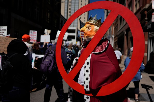 A person demonstrates during a "No Kings" protest Saturday, March 28, 2026, in Nashville, Tenn. (AP Photo/George Walker IV)