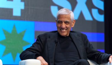 Vinod Khosla speaking at SXSW 2024, addressing tech innovations and entrepreneurship, wearing a suit on stage.