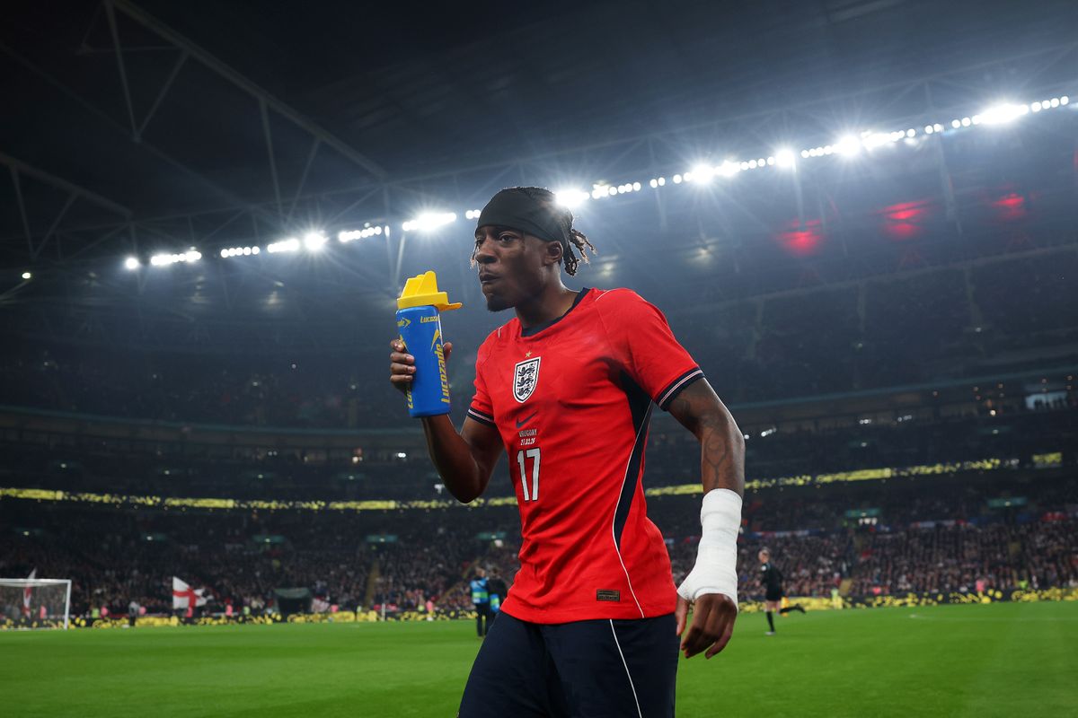 Noni Madueke of England drinks from a Lucozade bottle